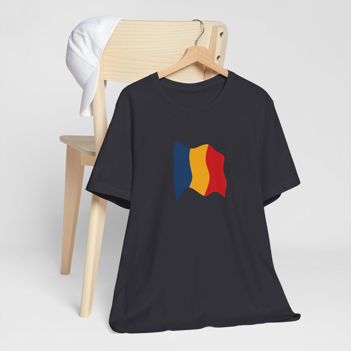 Romania flag T-shirt by Printify featuring a minimal waving tricolor design on a casual cotton tee.