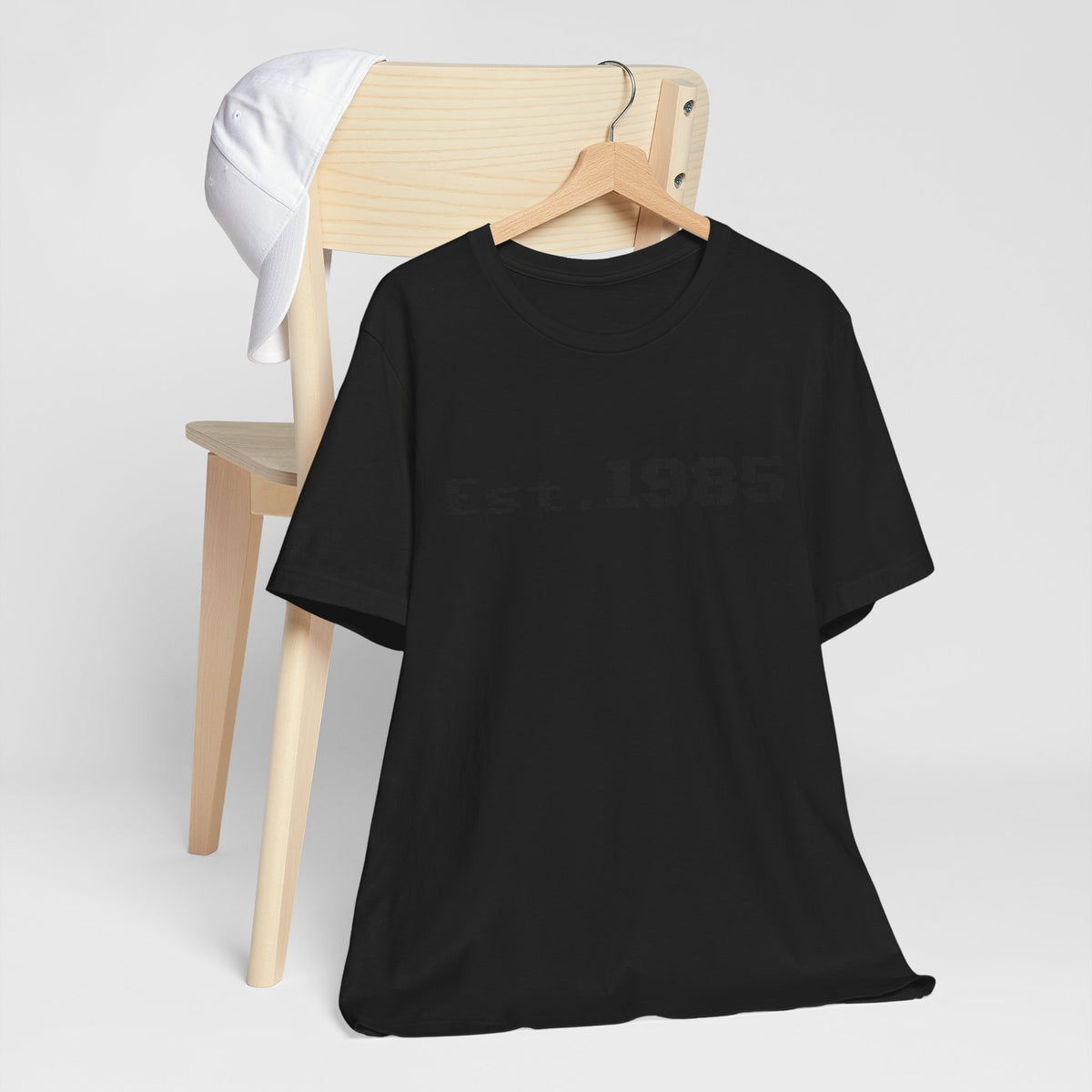 Vintage Est. 1985 graphic T-shirt by Printify featuring a retro year design on a classic cotton T-shirt.