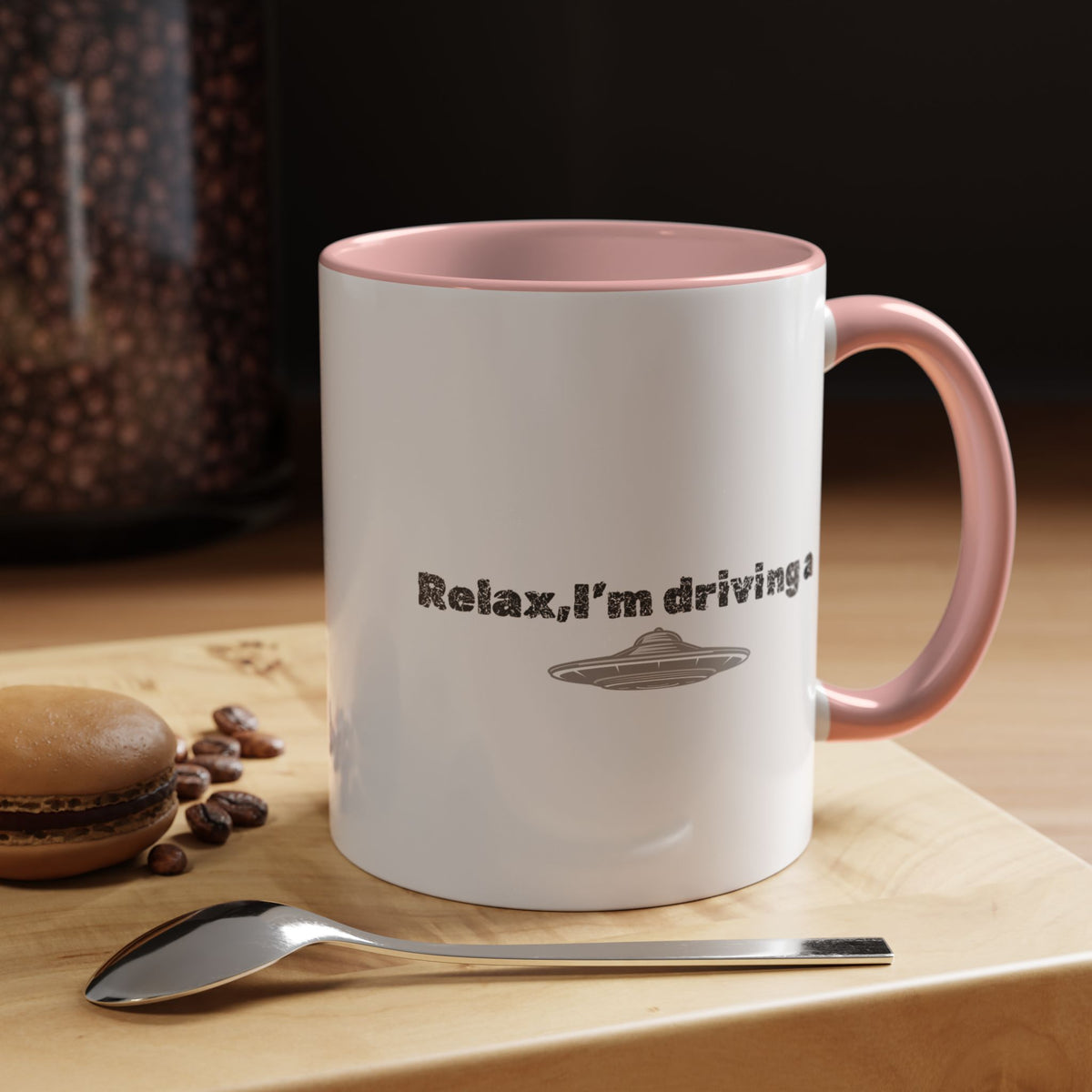 Ceramic coffee mug with UFO accent and "Relax, I’m Driving" phrase, 11 oz, in white with colorful UFO design.