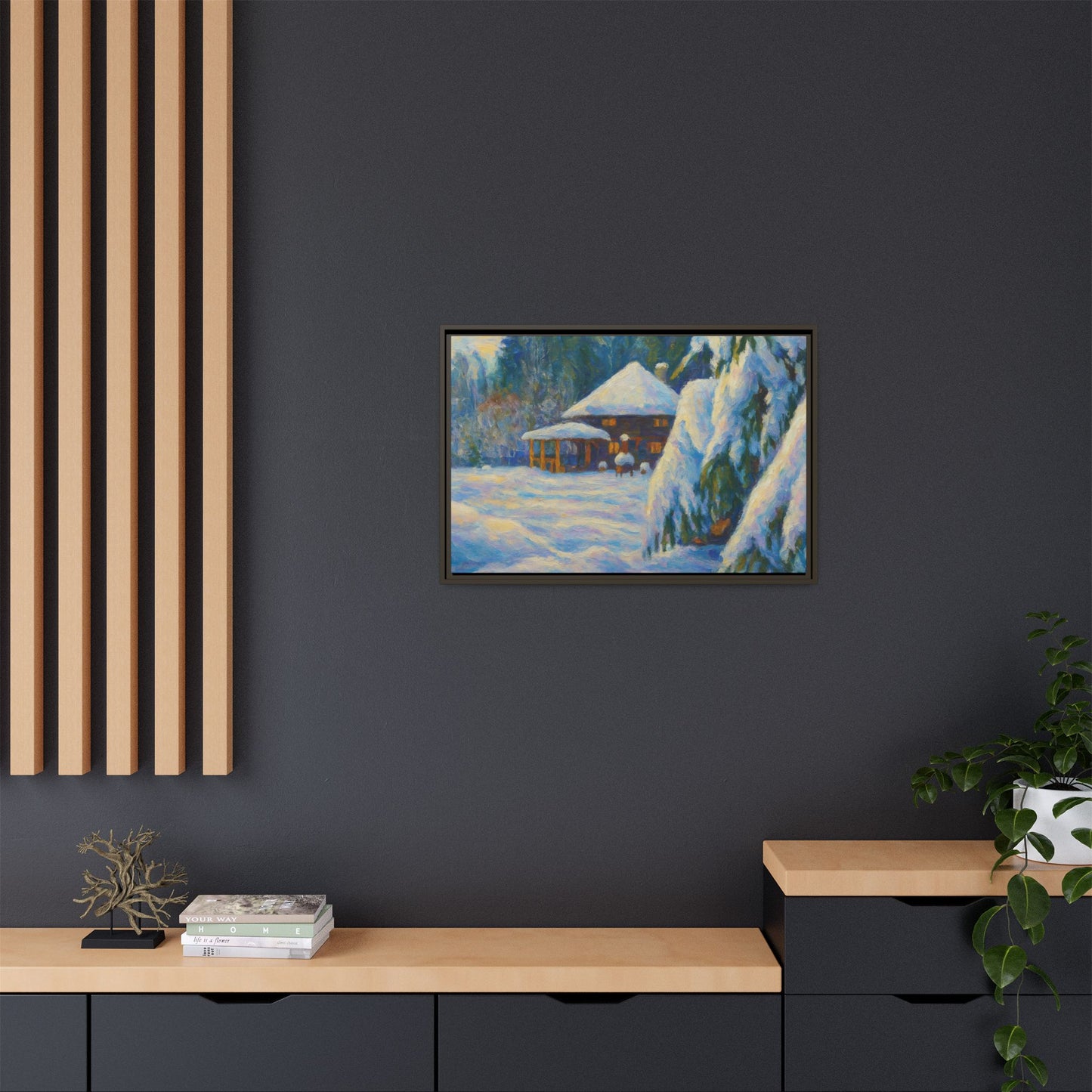 Framed matte canvas wall art featuring a snowy cabin winter landscape with trees and mountains, by Printify.