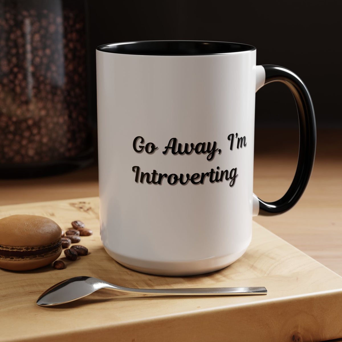 Ceramic coffee mug with "Go Away, I'm Introverting" text, 11 oz, black interior, perfect for introverts.