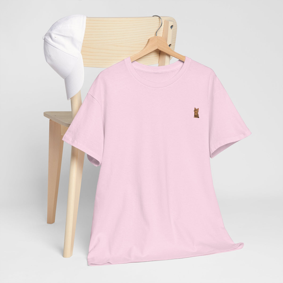 Cute brown kitten graphic T-shirt for cat lovers, featuring a playful cat design on a comfortable Printify T-shirt.