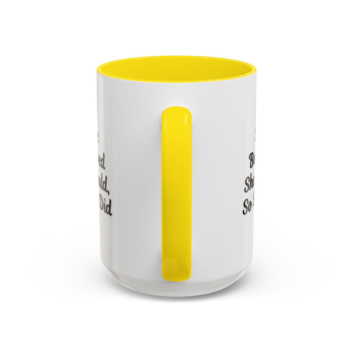 White ceramic motivational coffee mug with black text reading "She Believed She Could, So She Did" on a plain background.