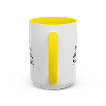 White ceramic motivational coffee mug with black text reading "She Believed She Could, So She Did" on a plain background.