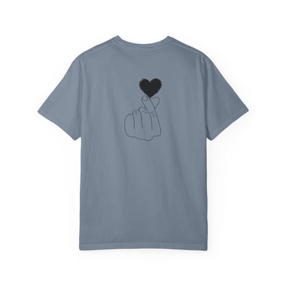 Black T-shirt with a minimal white finger heart graphic, casual style, by Printify.