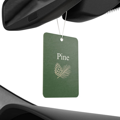 Green pinecone-shaped car air freshener with botanical scent and tag, designed as a decorative accessory for vehicles.