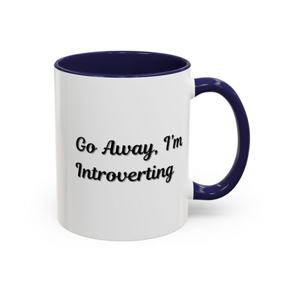 Ceramic coffee mug with "Go Away, I'm Introverting" text, 11 oz size, designed for introverts, by Printify.