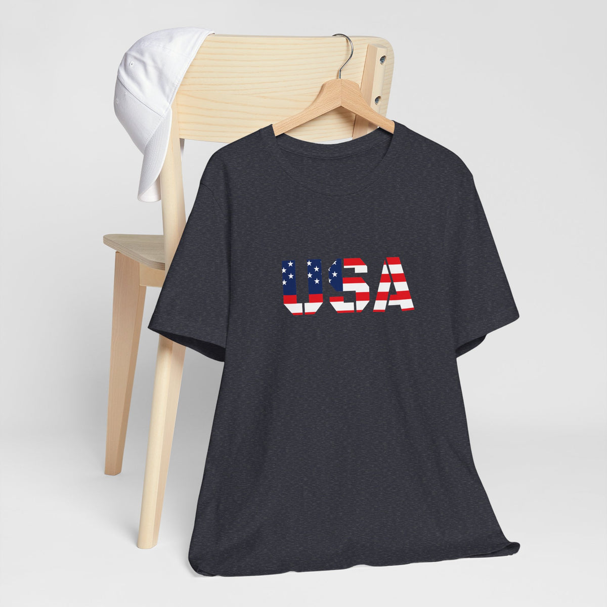 USA flag text patriotic T-shirt by Printify featuring bold American flag design on a casual T-shirt.