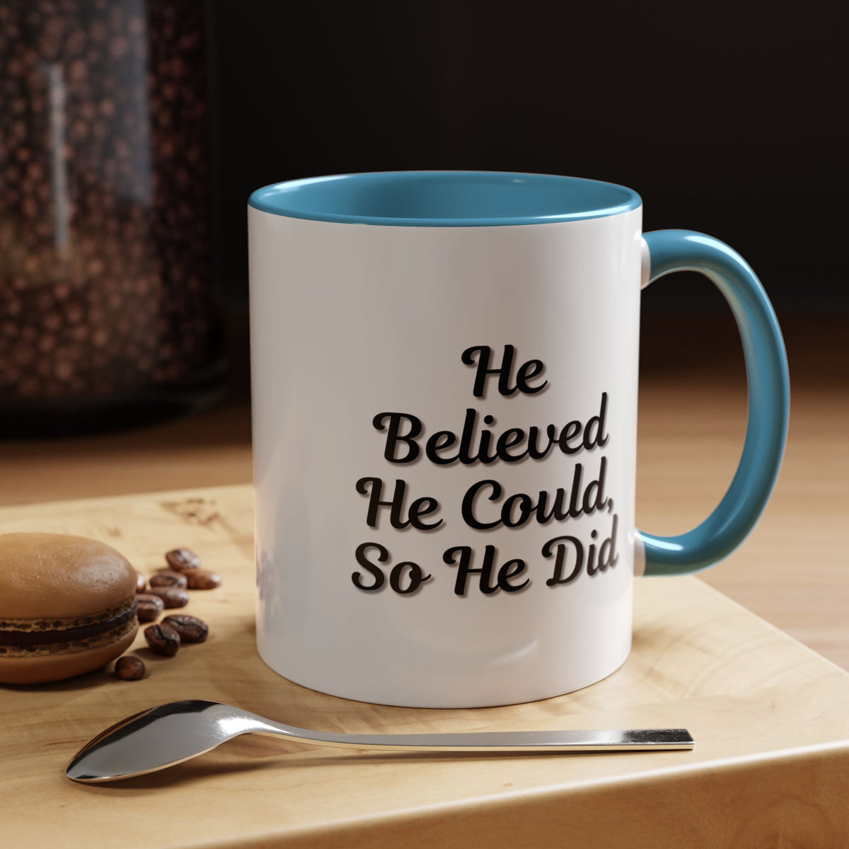 Printify "He Believed He Could So He Did" inspirational coffee mug with bold black text on a white ceramic mug.