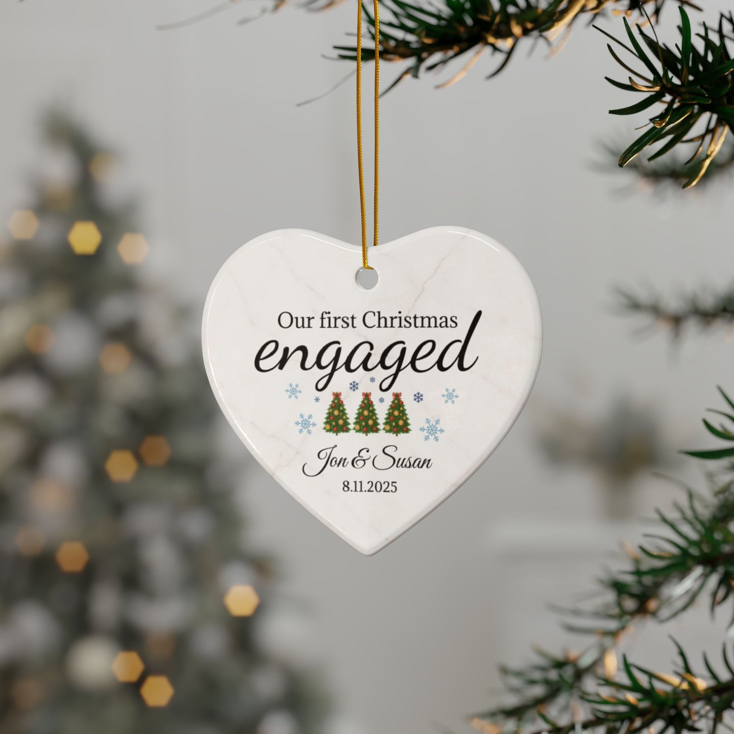 Ceramic "Our First Christmas Engaged" heart ornament with festive design, perfect for celebrating the holiday season.