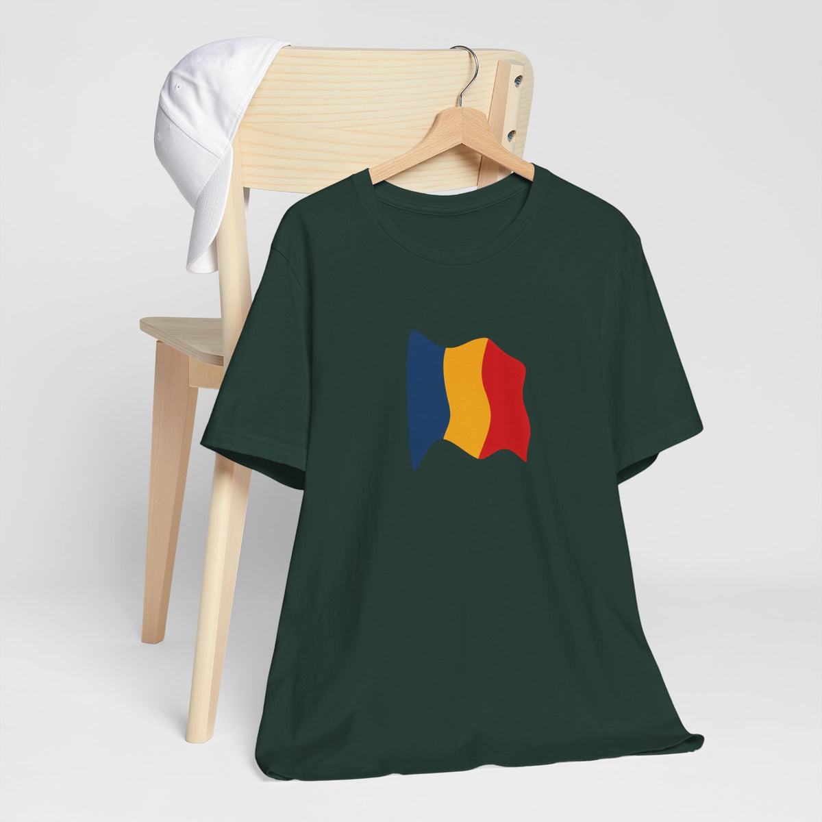 Romania flag T-shirt by Printify featuring a minimal waving tricolor design on a casual cotton tee.