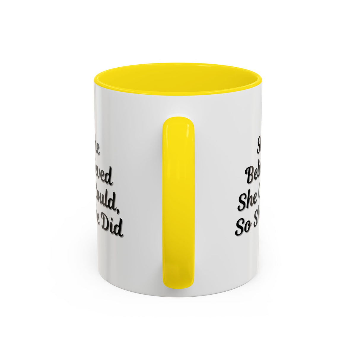 Motivational coffee mug with the phrase "She Believed She Could, So She Did" in black text on a white ceramic mug.