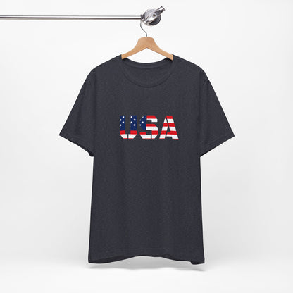 USA flag text T-shirt by Printify featuring patriotic Fourth of July design, casual cotton tee with red, white, and blue flag print.