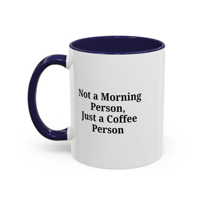 Ceramic coffee mug with "Not a Morning Person, Just a Coffee Person" printed design, perfect for morning beverage lovers.