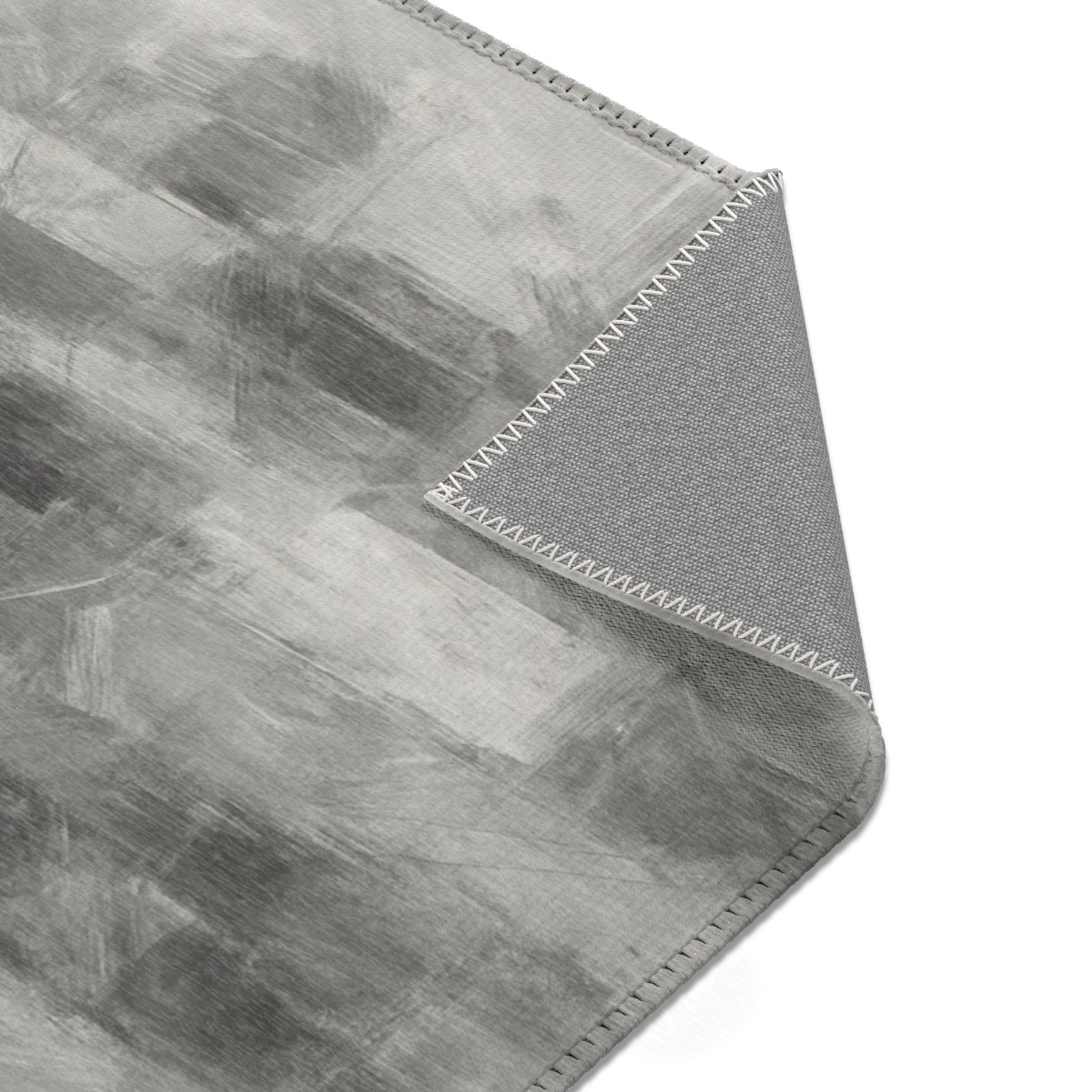 Abstract gray watercolor area rug by Printify, modern neutral design suitable for living room accents.