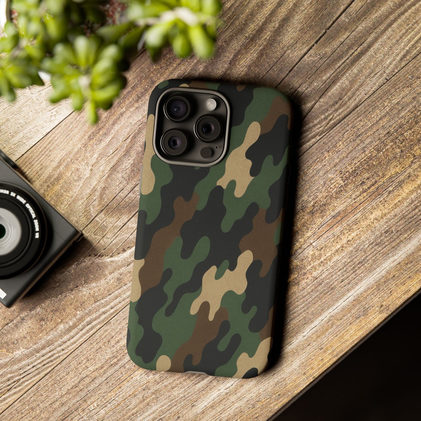 Camouflage tough phone case by Printify showing a rugged camo protective case on a smartphone.