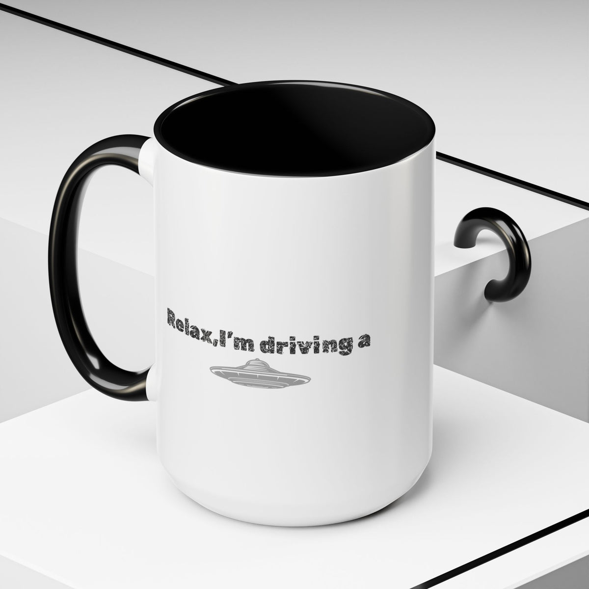 Ceramic coffee mug with "Relax, I’m Driving" UFO accent design, 11 oz, featuring a colorful extraterrestrial motif.