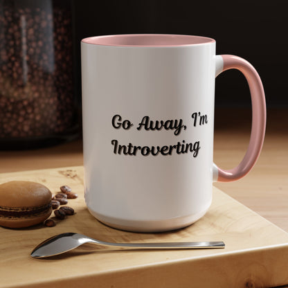 Ceramic coffee mug with "Go Away, I'm Introverting" text in black, 11 oz size, Printify brand, on a white background.