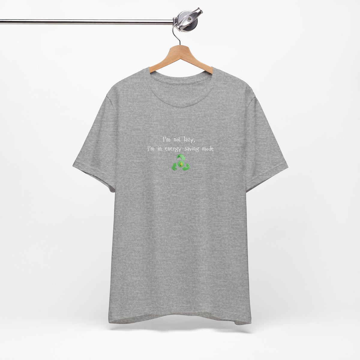 Eco humor T-shirt featuring the phrase "I’m Not Lazy, I’m an Energy-Saving Mock" on a casual Printify T-shirt.