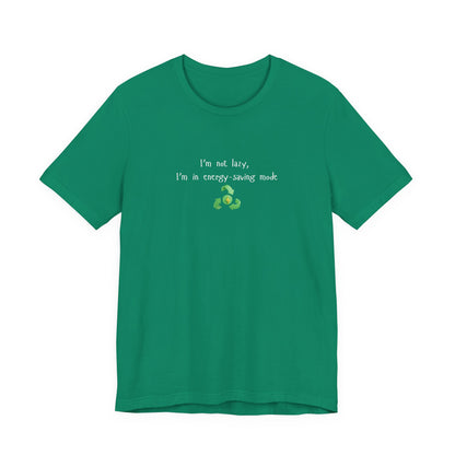 Eco humor T-shirt featuring the slogan "I’m Not Lazy, I’m an Energy-Saving Mock" on a casual printify T-shirt.