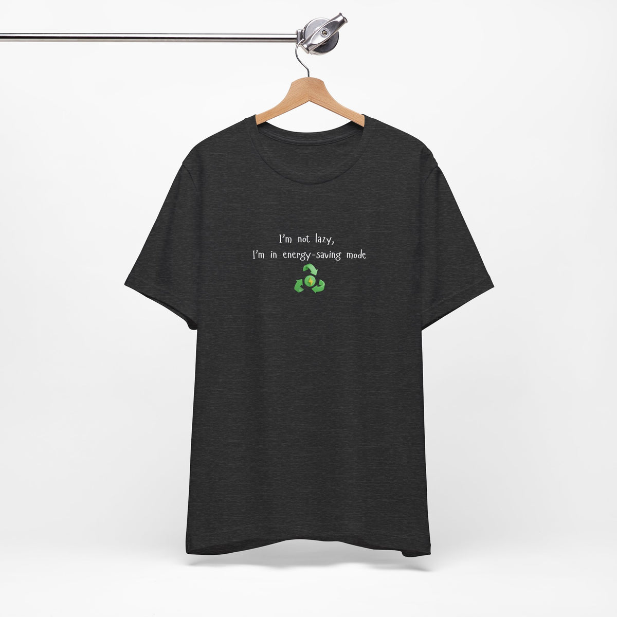 Eco humor T-shirt featuring the phrase "I’m Not Lazy, I’m an Energy-Saving Mock" on a casual Printify T-shirt.