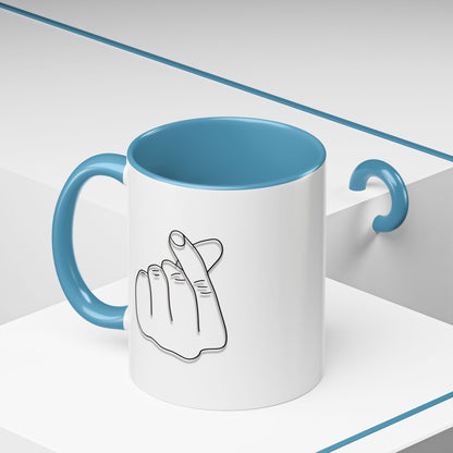 Minimal Korean finger heart accent mug by Printify, 11oz or 15oz ceramic coffee mug with simple design and love-themed detail.