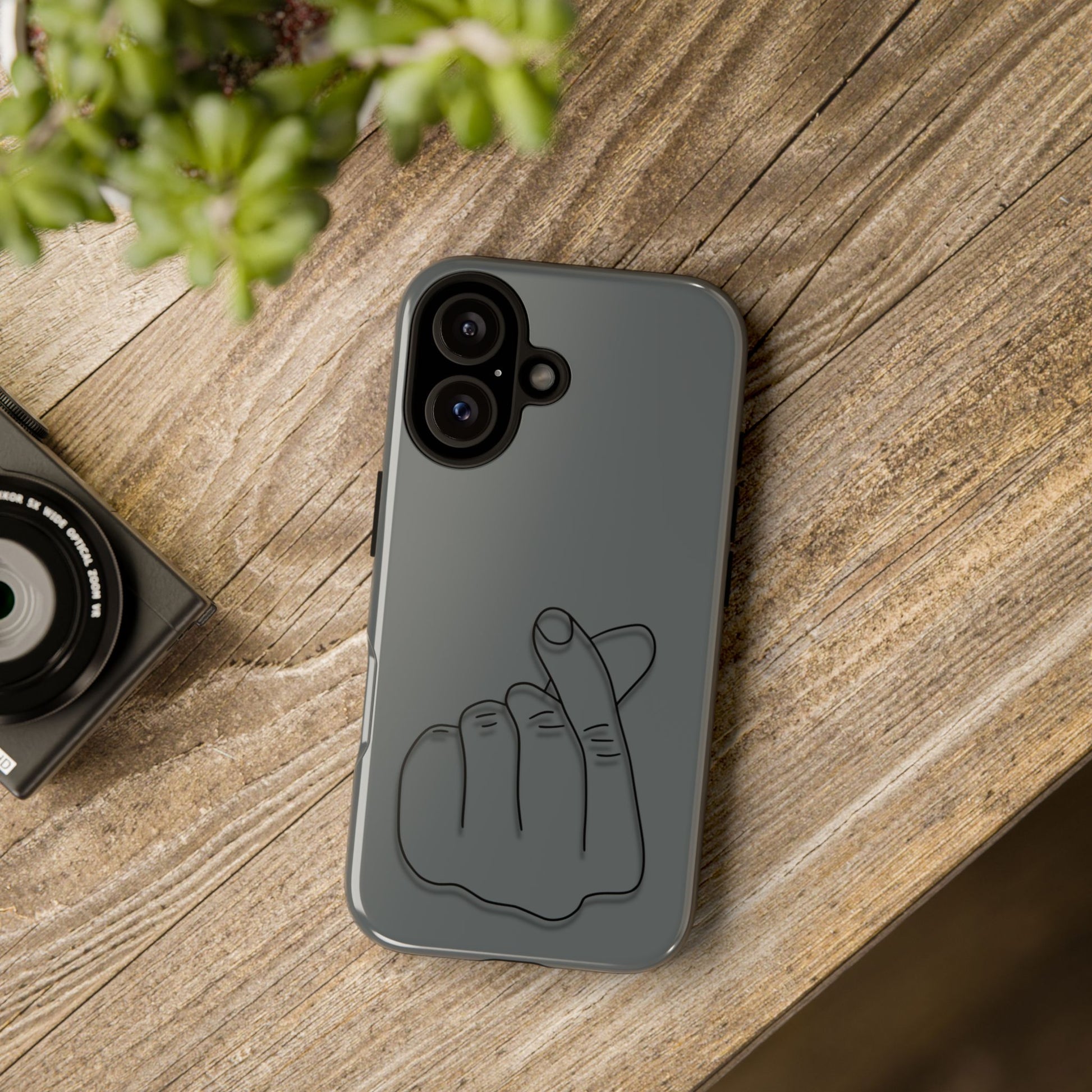 Silicone phone case with embossed Korean finger heart design, protective cover for smartphones, by Printify.
