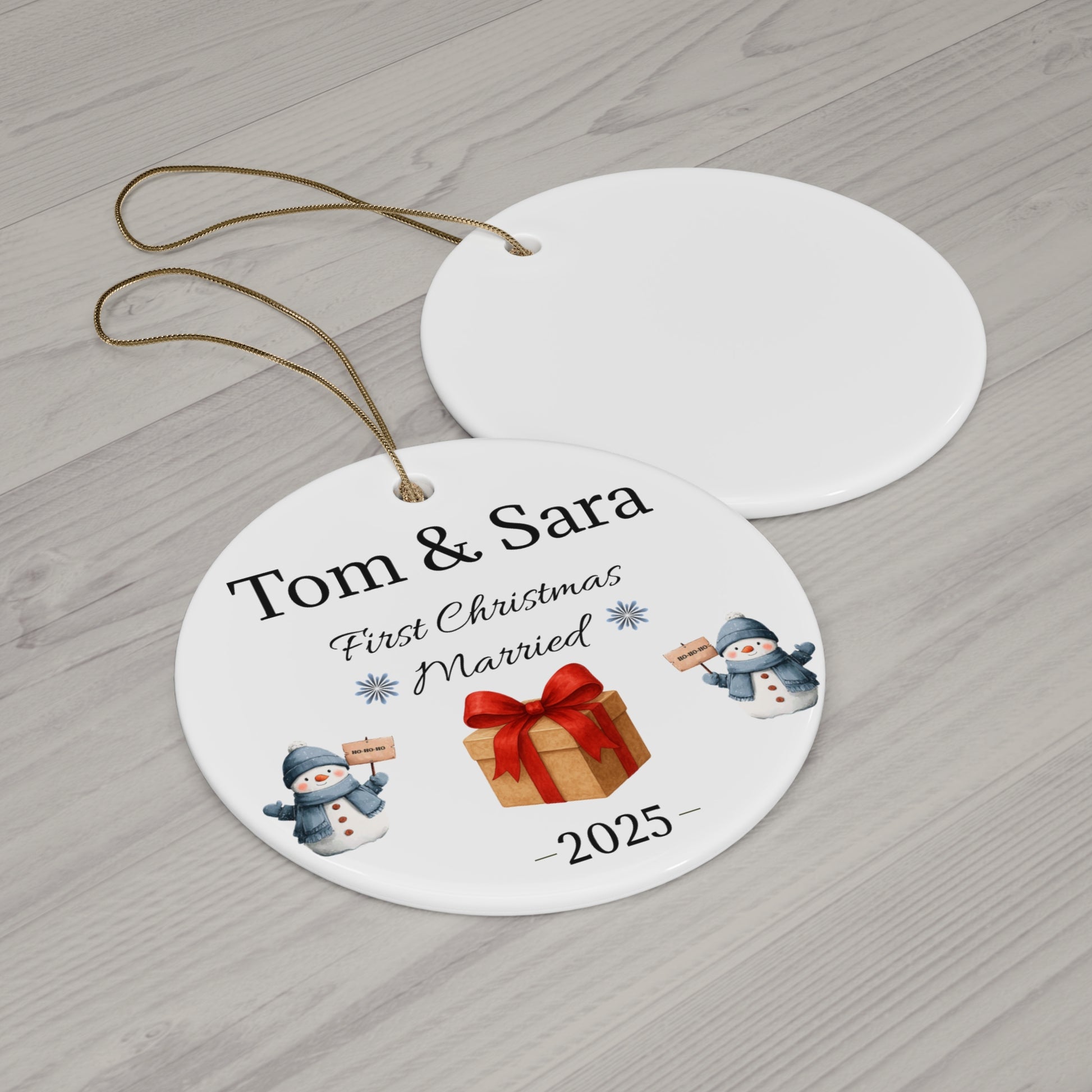 Personalized ceramic ornament with "Tom & Sara First Christmas Married 2025" text, featuring festive holiday design.