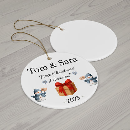 Personalized ceramic ornament with "Tom & Sara First Christmas Married 2025" text, featuring festive holiday design.