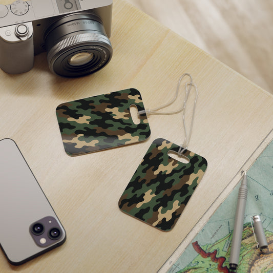 Green woodland camo pattern luggage tag with ID holder, designed for travel accessories by Printify.